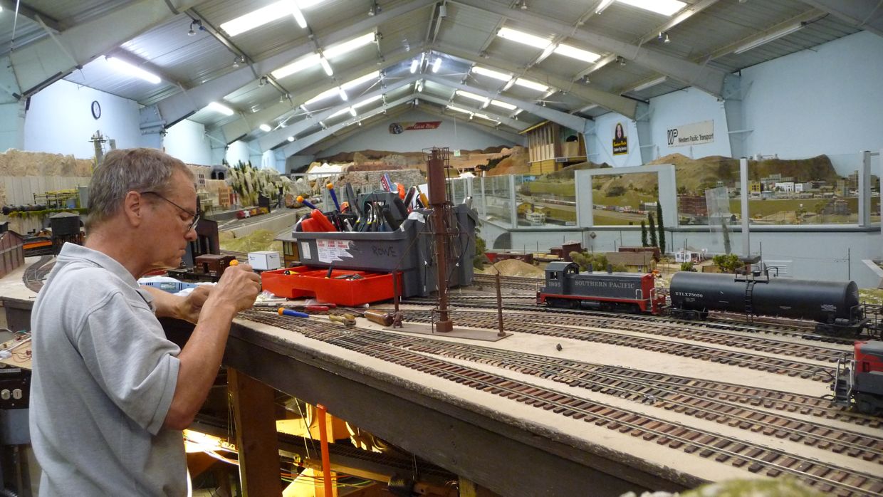 Jeff Rowe working on rod and linkage control of diesel yard turnouts.