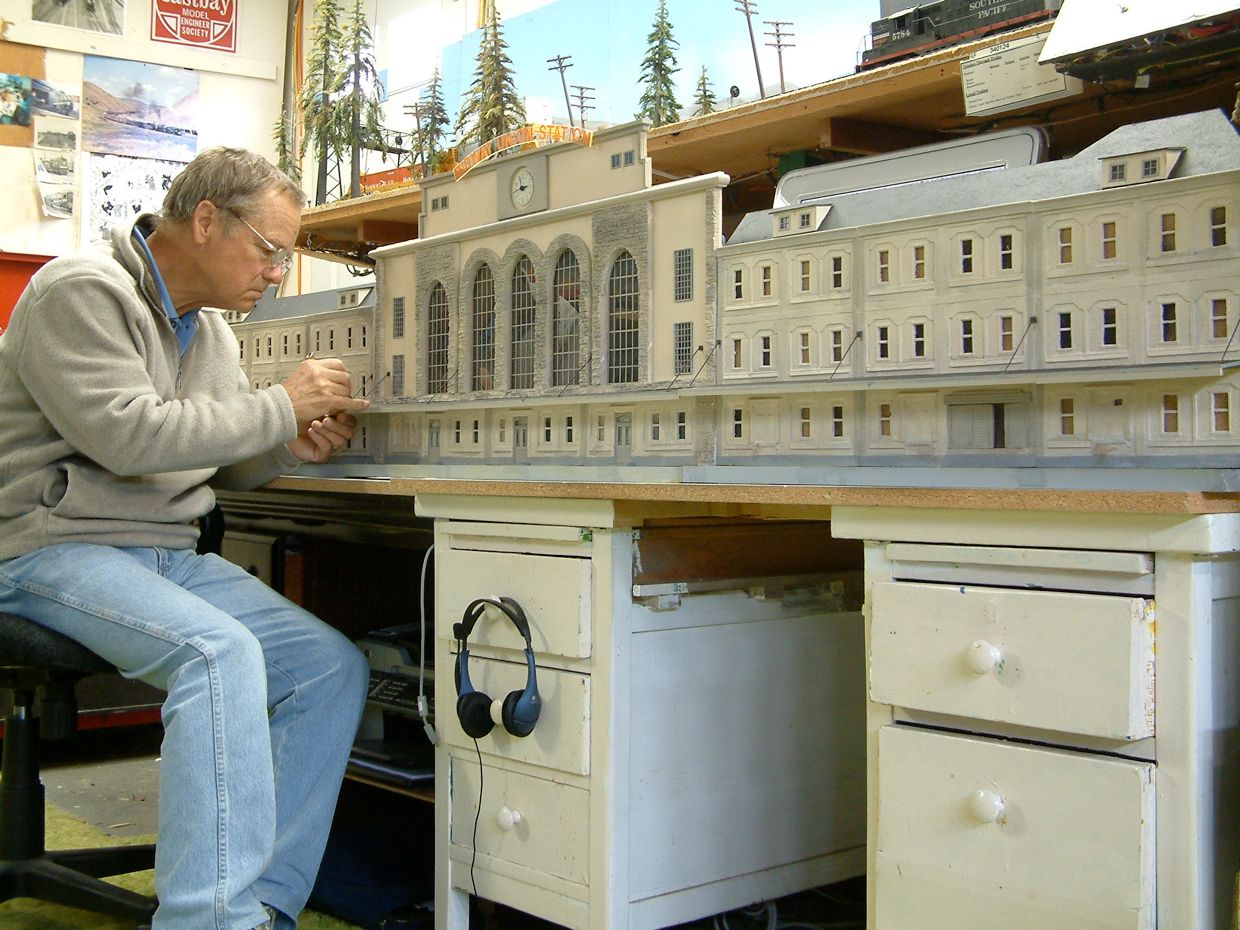 Jeff Rowe adding finishing detail on Midway Union Station.