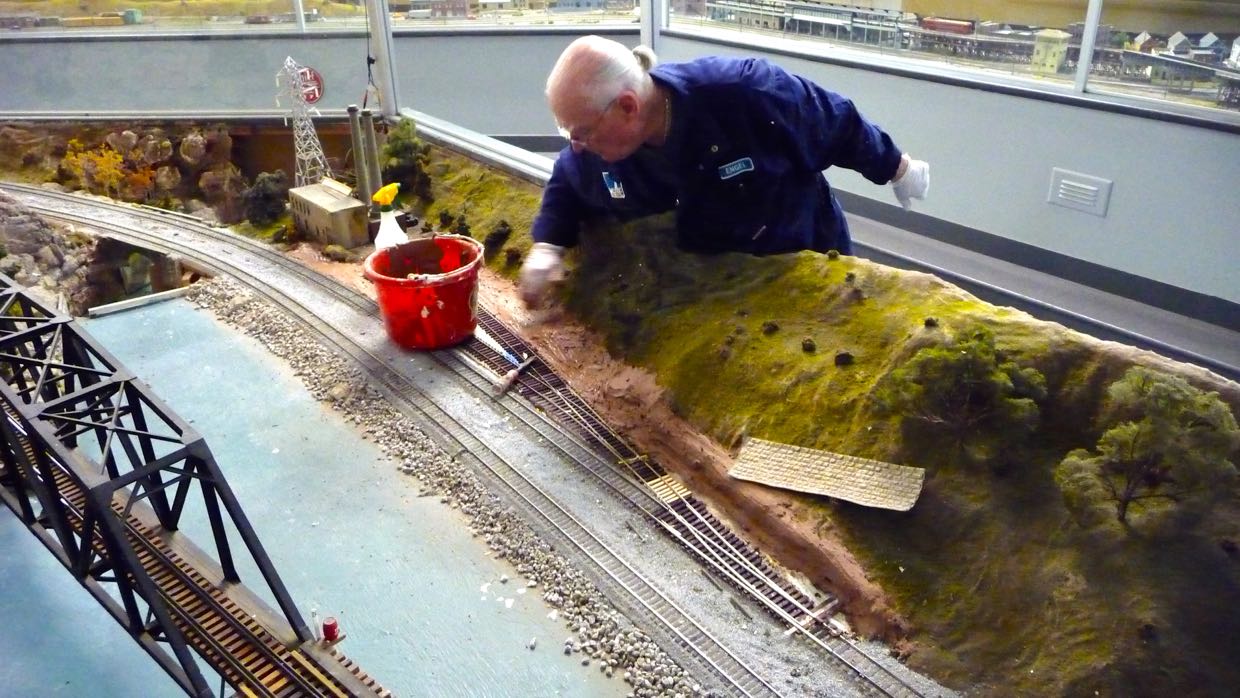 John Engel applying plaster at PowerHouse